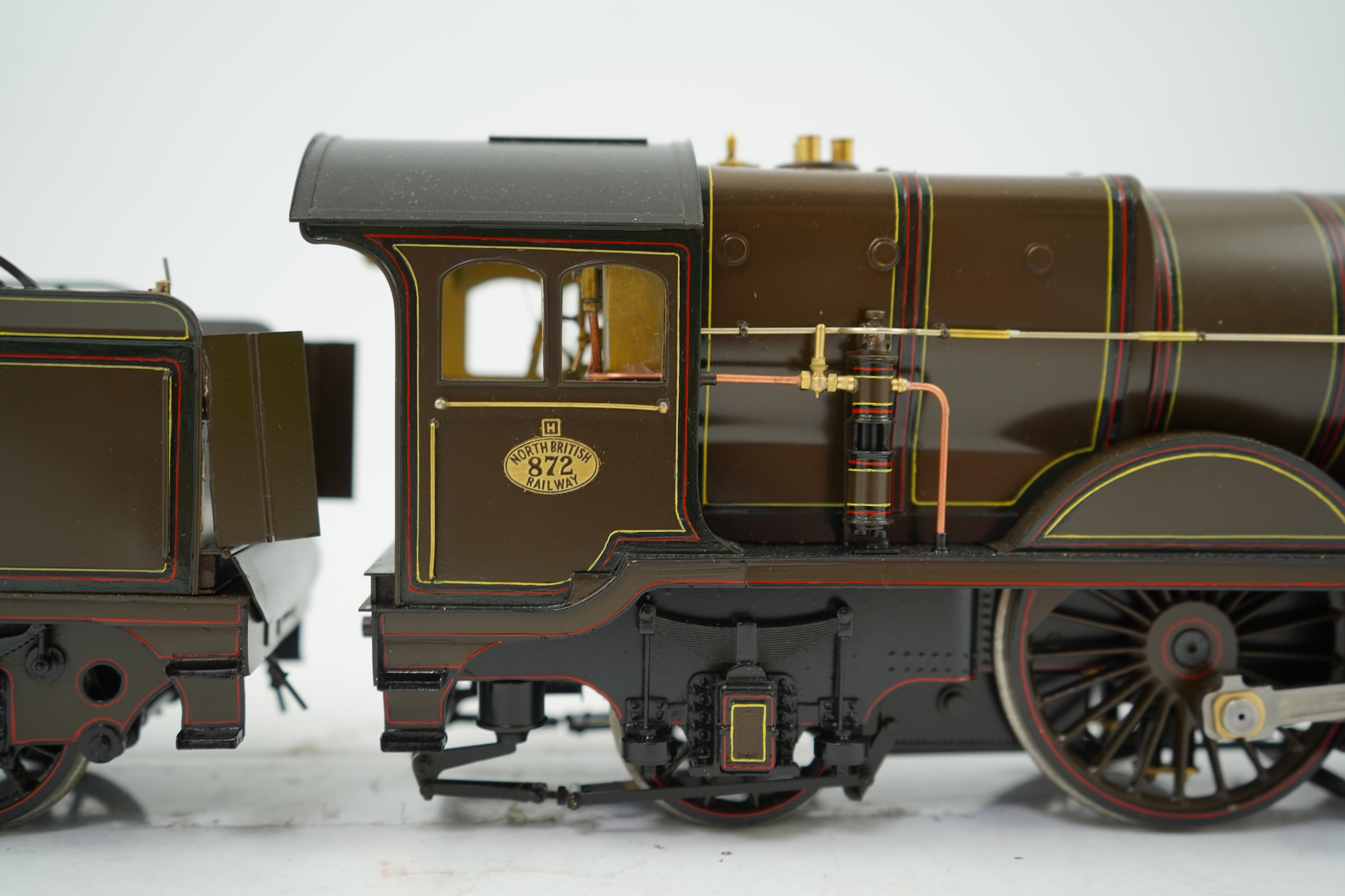 A Gauge One model of North British Railways H Class Auld Reekie 872, 4-4-2 Atlantic tender locomotive, the model has been left unpowered to allow for a high level of detailing of the valve gear and cylinders between the